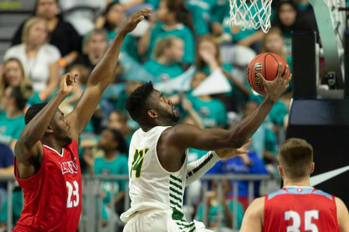 San Francisco Dons guard Charles Minlend (14) drives past Loyola Marymount Lions forward Jordan ...