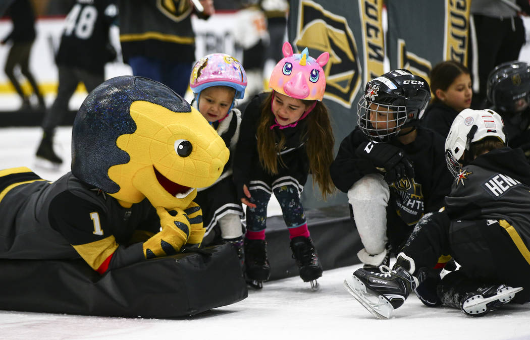 Golden Knights mascot Chance interacts with young fans on the ice at City National Arena during ...