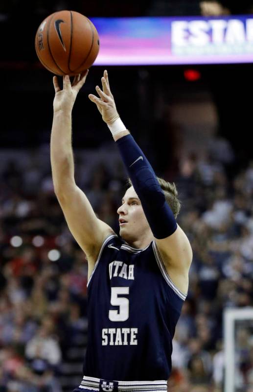 Utah State's Sam Merrill shoots against San Diego State during the first half of an NCAA colleg ...