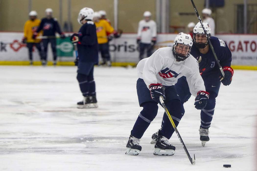 In this photo taken Monday, Nov. 4, 2019, Kendall Coyne-Schofield, center, a member of the U.S. ...