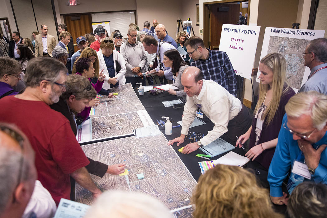 Locals ask city officials questions about traffic and congestion at a meeting the city hosted t ...