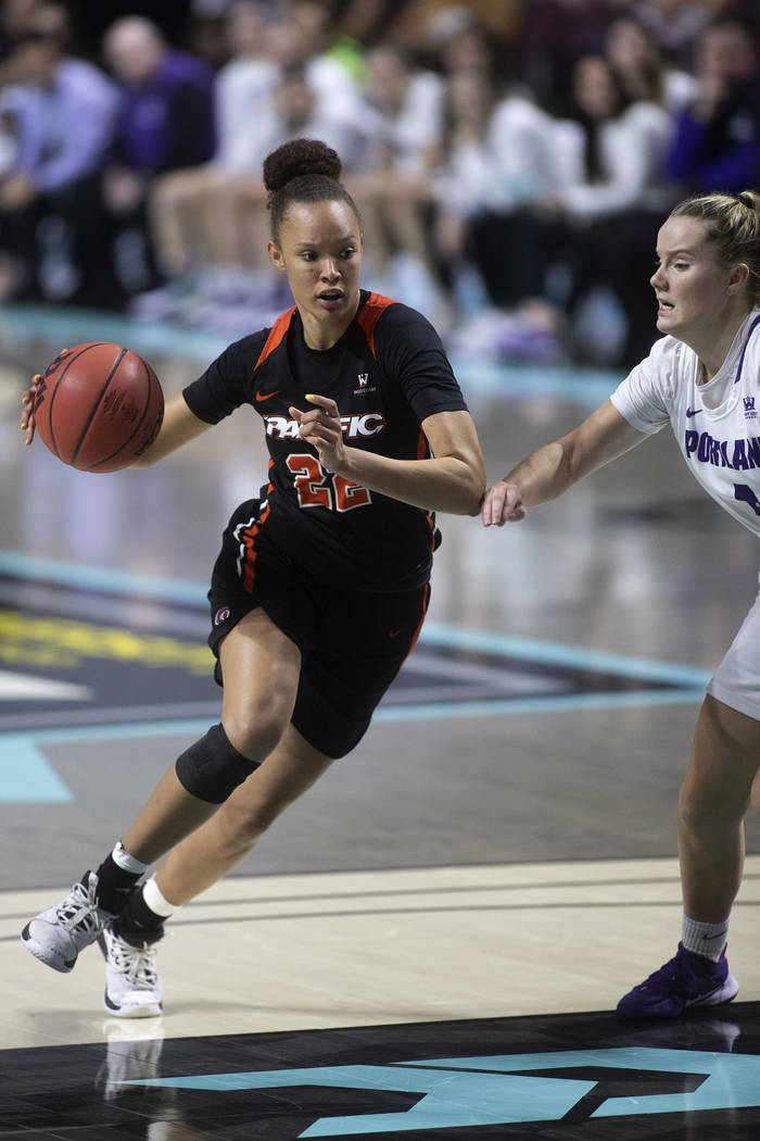 University of the Pacific's guard Valerie Higgins (22) dribbles down the court against Universi ...