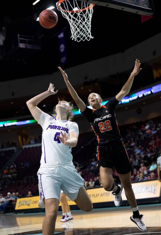 University of Portland's forward Keeley Frawley (4) watches her team's point near the basket as ...