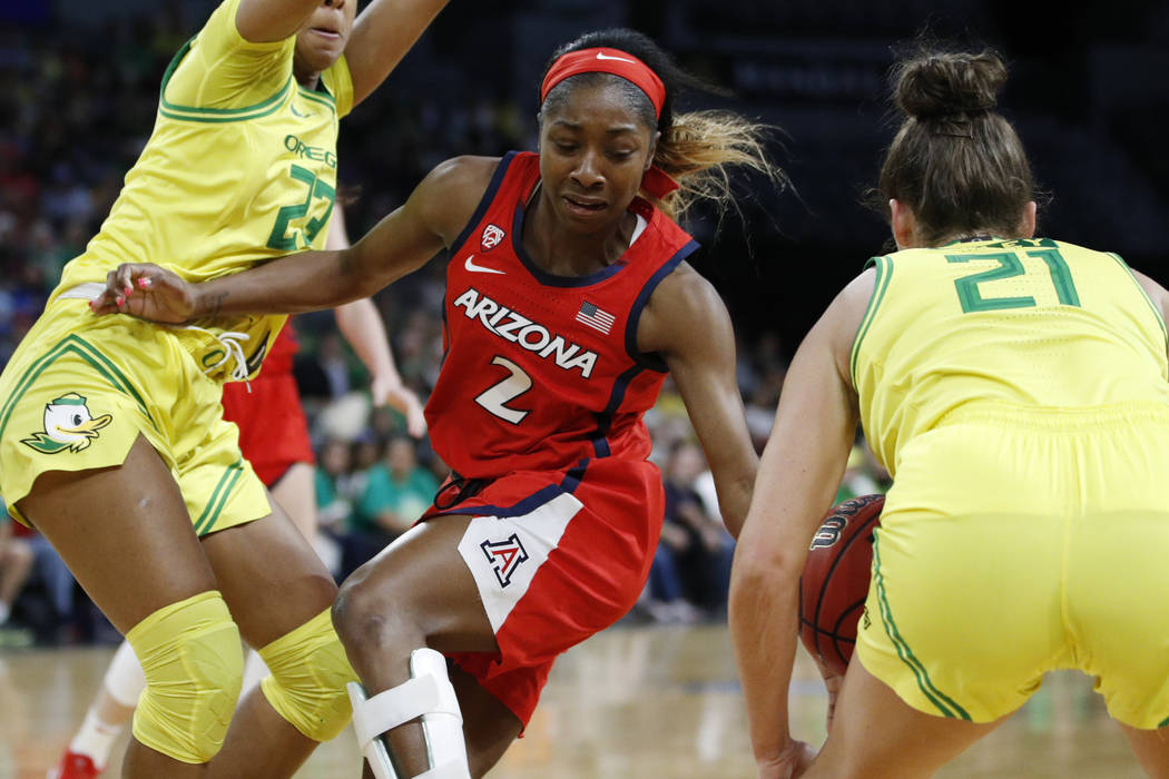 Oregon's Erin Boley (21) steals the ball from Arizona's Aarion McDonald (2) during the first ha ...