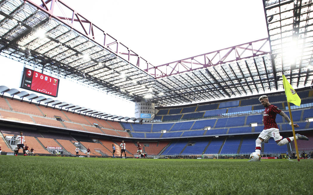 AC Milan's Samu Castillejo kicks from the corner in an empty stadium during the Serie A soccer ...