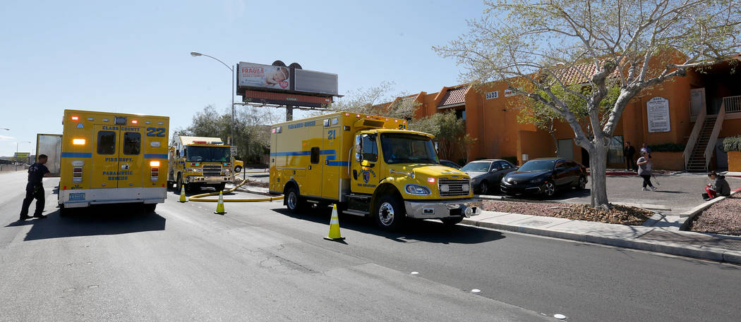 Firefighters investigate the building at 5333 S. Arville Street in Las Vegas, Sunday, March 8, ...