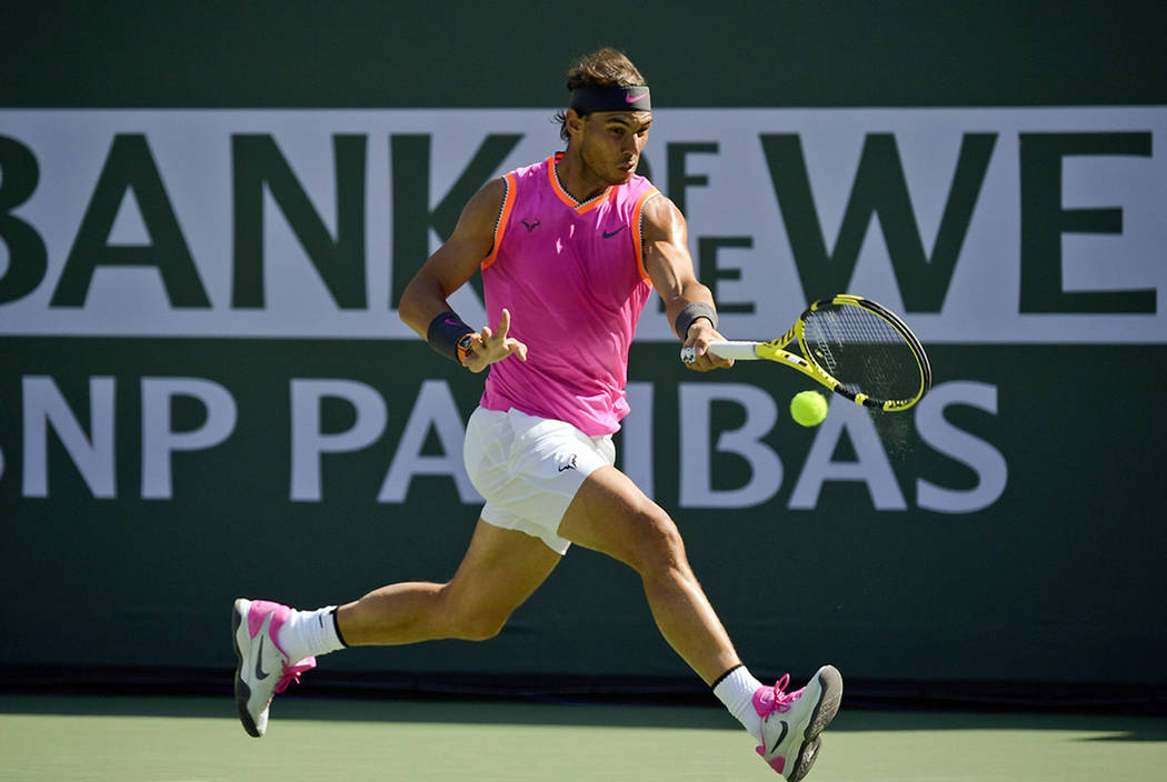 Rafael Nadal, of Spain, hits a forehand to Karen Khachanov, of Russia, at the BNP Paribas Open ...