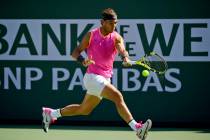 Rafael Nadal, of Spain, hits a forehand to Karen Khachanov, of Russia, at the BNP Paribas Open ...