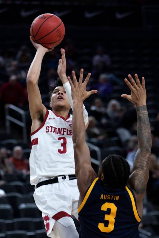 Stanford's guard Tyrell Terry (3) shoots a point as California's guard Paris Austin (3) jumps t ...