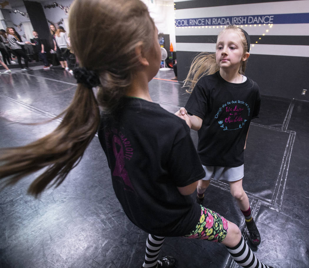 Annabell Hilliard, right, and Lily Ulate practice at Scoil Rince Ni Riada Irish Dance on Wednes ...