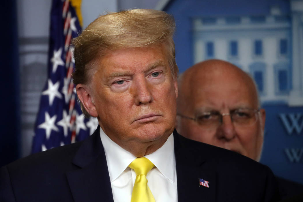 President Donald Trump listens in the briefing room of the White House in Washington, Monday, M ...