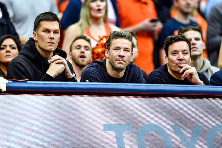 New England Patriots' Tom Brady, left, and Julian Edelman, center, along with comedian Jimmy Fa ...