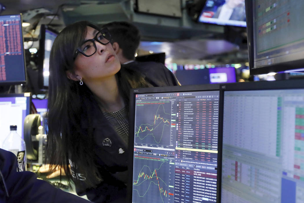 Specialist Erica Fredrickson works on the floor of the New York Stock Exchange, Monday, March 9 ...