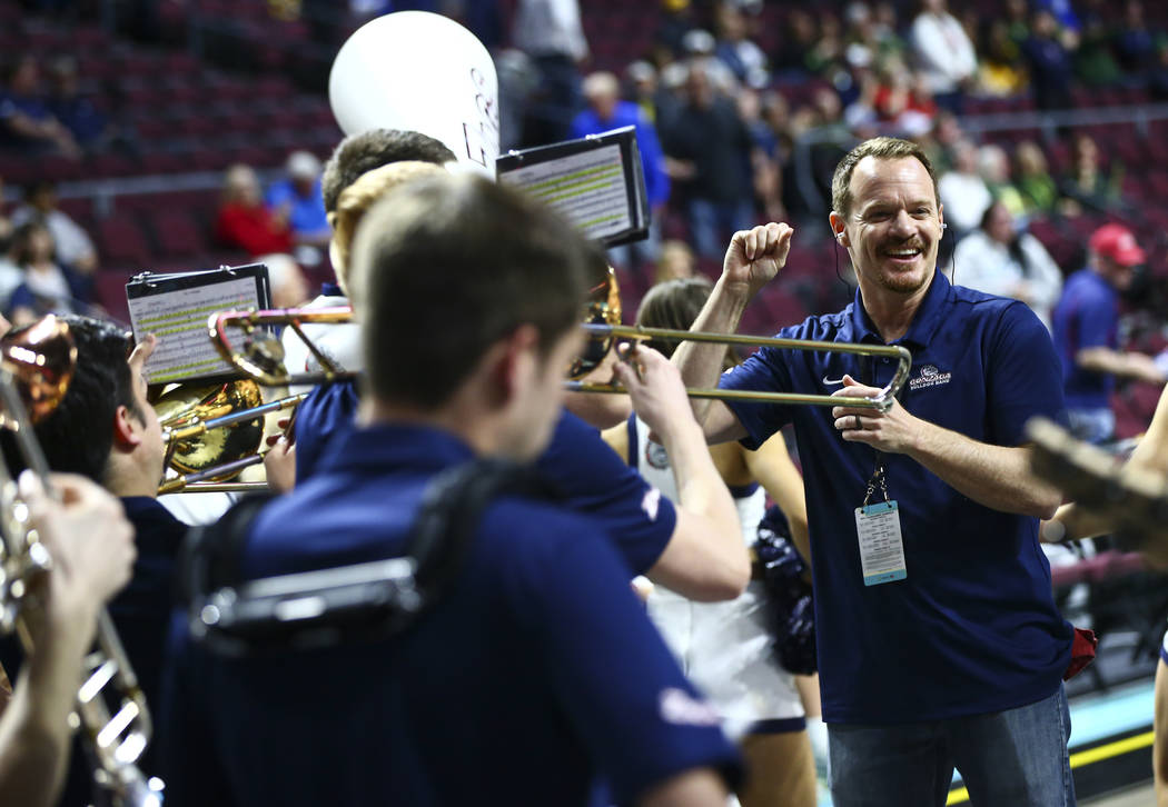 David Fague, director of the Gonzaga band, leads the group before the start of a West Coast Con ...