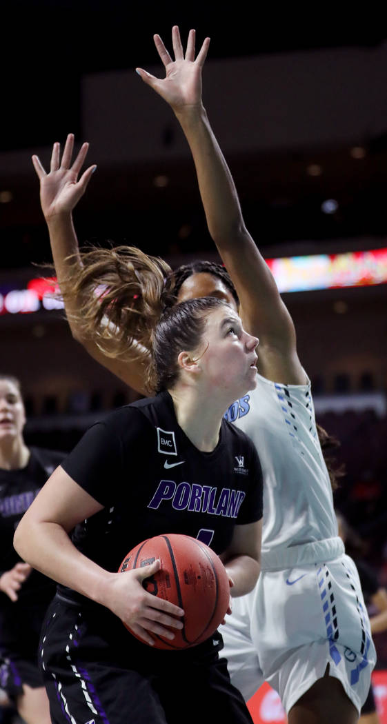 Portland Pilots Kate Andersen (1) gets ready to shoot a basket against the San Diego Toreros in ...