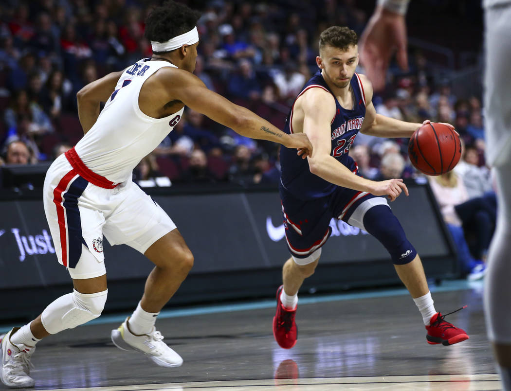 St. Mary's Gaels' guard Kristers Zoriks (23) drives to the basket against Gonzaga Bulldogs' gua ...