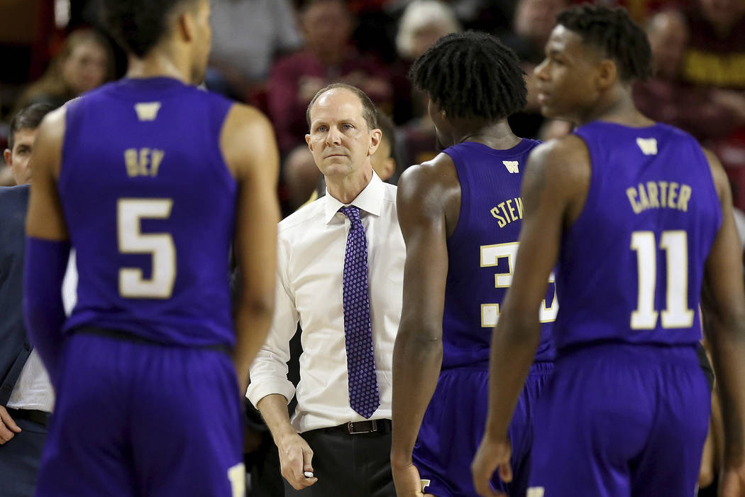 Washington head coach Mike Hopkins waits for his player during a timeout against Arizona State ...