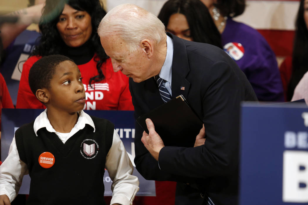 Democratic presidential candidate former Vice President Joe Biden, right, speaks with Deaunte B ...