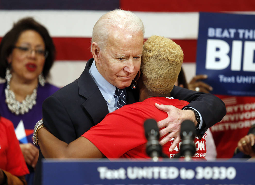 Democratic presidential candidate former Vice President Joe Biden hugs Crystal Turner of Columb ...