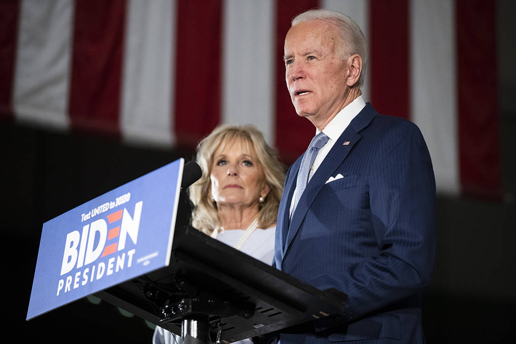 Democratic presidential candidate former Vice President Joe Biden, accompanied by his wife Jill ...