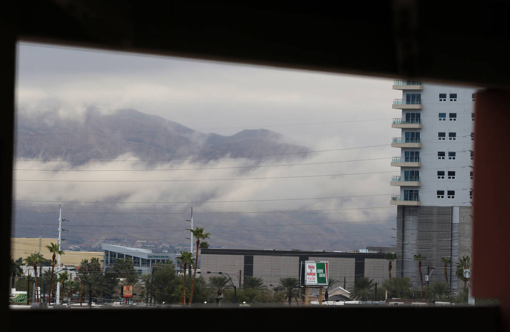 Clouds linger over the Las Vegas valley as seen from the Las Vegas North Premium Outlets' parki ...