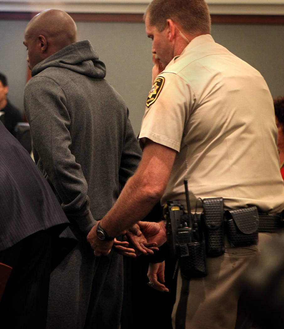 Marshall Ron Johnson prepares to handcuff boxer Floyd Mayweather Jr.'s hands Friday, June 1, 20 ...