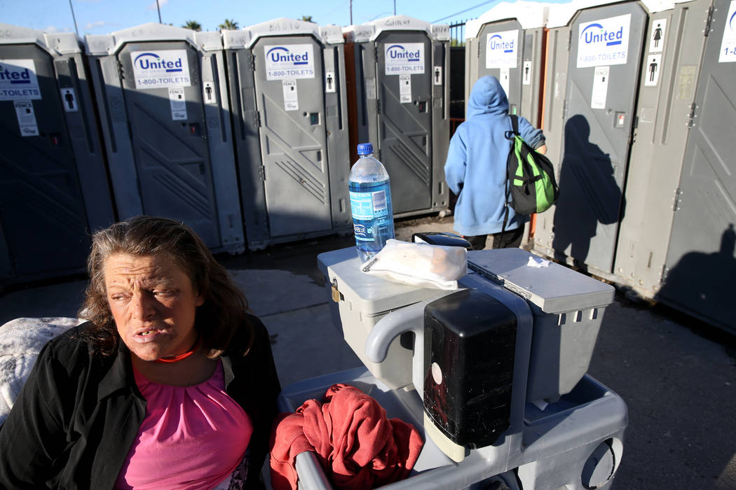 Erica "E.Z." Zehm, 42, at hand washing stations at The Courtyard Homeless Resource Ce ...