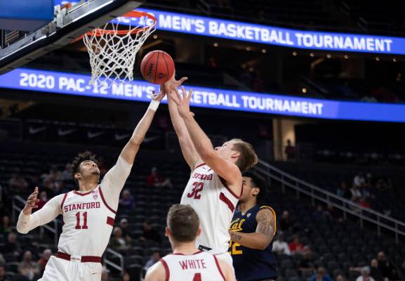 Stanford's forward Jaiden Delaire (11) and forward Lukas Kisunas (32) jump to block a shot by U ...
