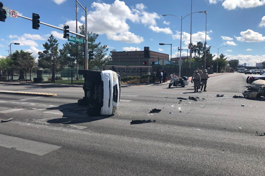 Police investigate a crash Wednesday, March 11, 2020, at the intersection of West Washington Av ...