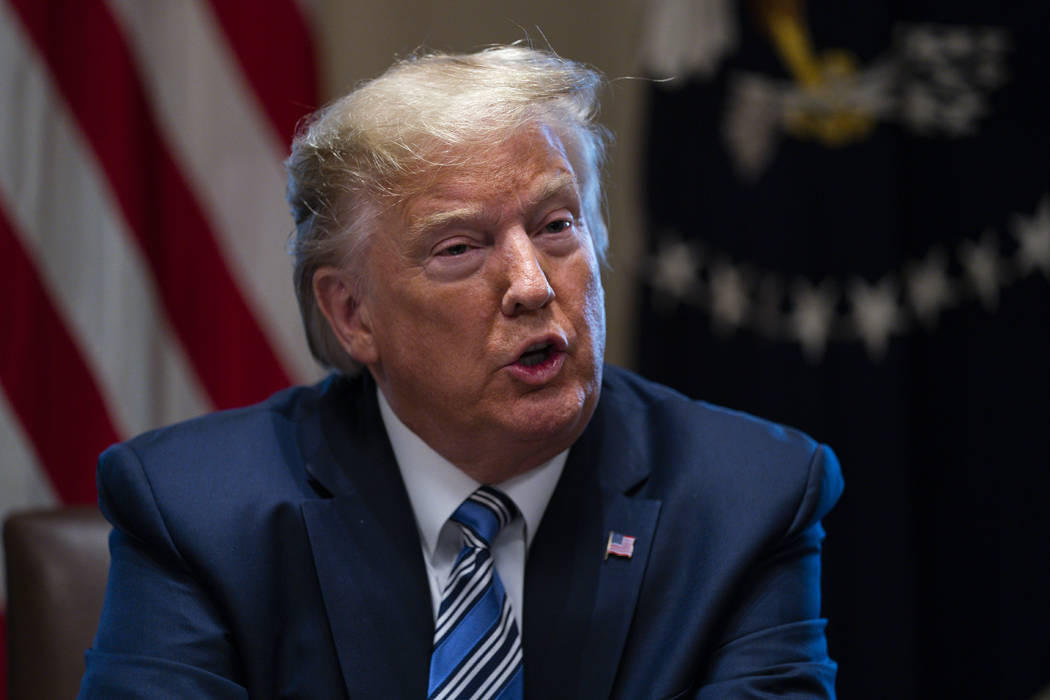 President Donald Trump speaks during a meeting with banking industry executives about the coron ...