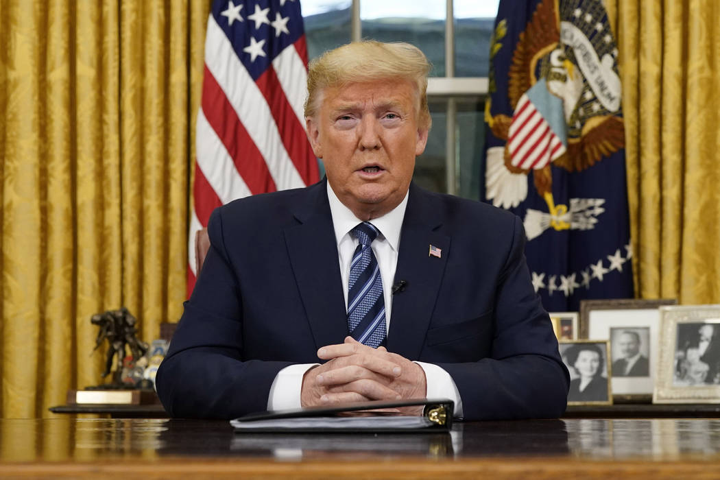 President Donald Trump speaks in an address to the nation from the Oval Office at the White Hou ...