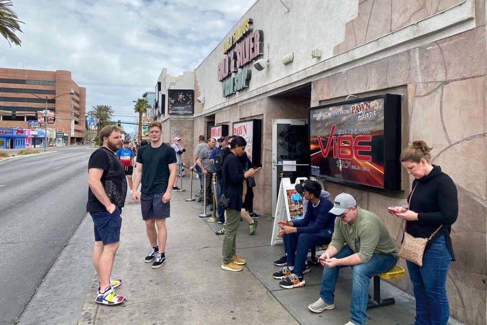 Customers line up at Gold & Silver Pawn, where the TV show "Pawn Stars" is filmed, in downtown ...