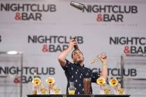 Harry Rivera performs in the flair bartending competition at the Nightclub and Bar Show on Tues ...