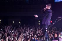 Brandon Flowers of The Killers performs with the band to a sold-out crowd during the opening ni ...