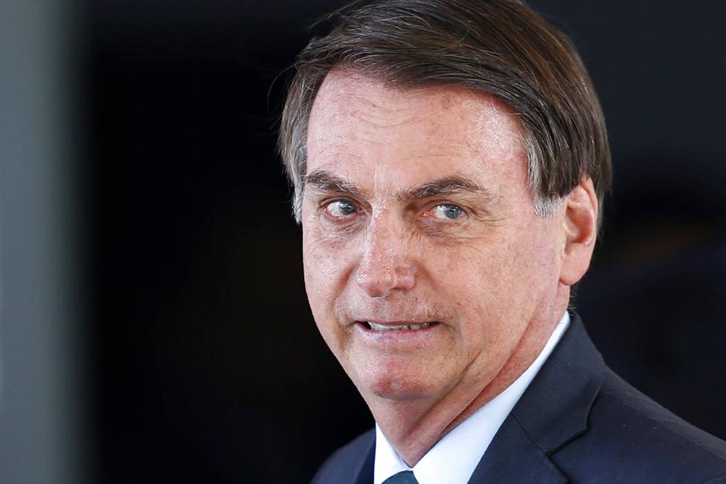 Brazil's President Jair Bolsonaro speaks to journalists after meeting with military commanders ...