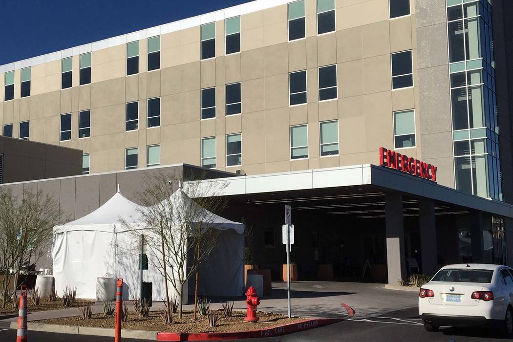 A tent sits outside the emergency room at Sunrise Hospital and Medical Center for health screen ...