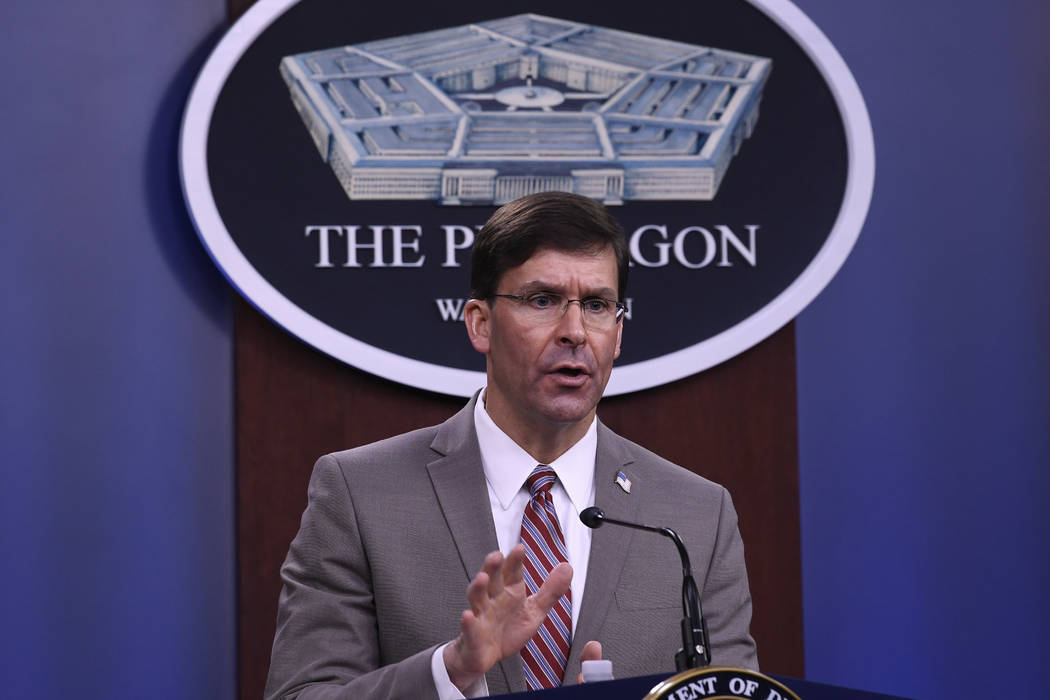 Defense Secretary Mark Esper speaks during a briefing at the Pentagon in Washington, Monday, Ma ...