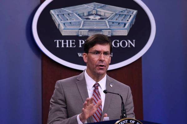 Defense Secretary Mark Esper speaks during a briefing at the Pentagon in Washington, Monday, Ma ...