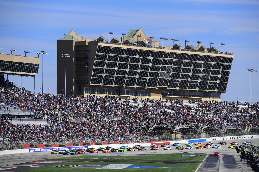 A NASCAR Monster Energy NASCAR Cup Series auto race starts at Atlanta Motor Speedway in Hampton ...
