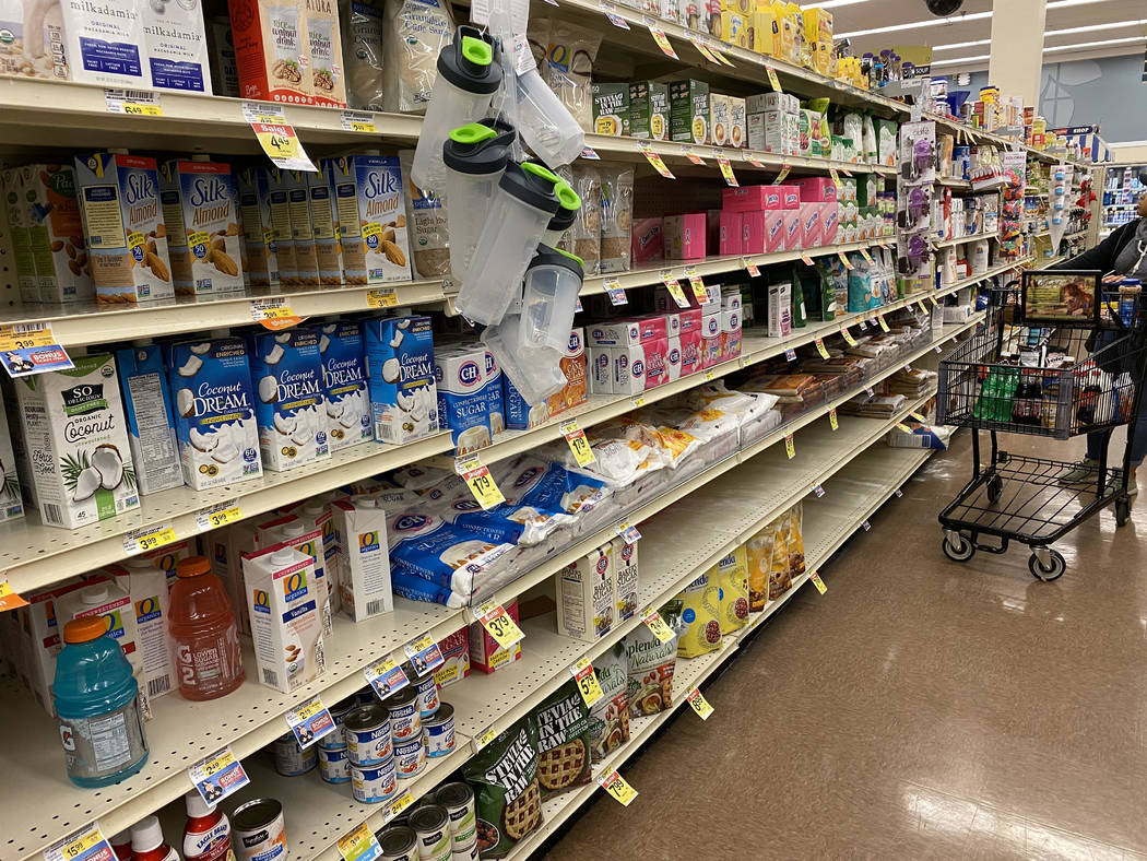 A woman shops at Smith's at 8555 West Sahara Ave. in Las Vegas, Friday, March 13, 2020. (Bill B ...