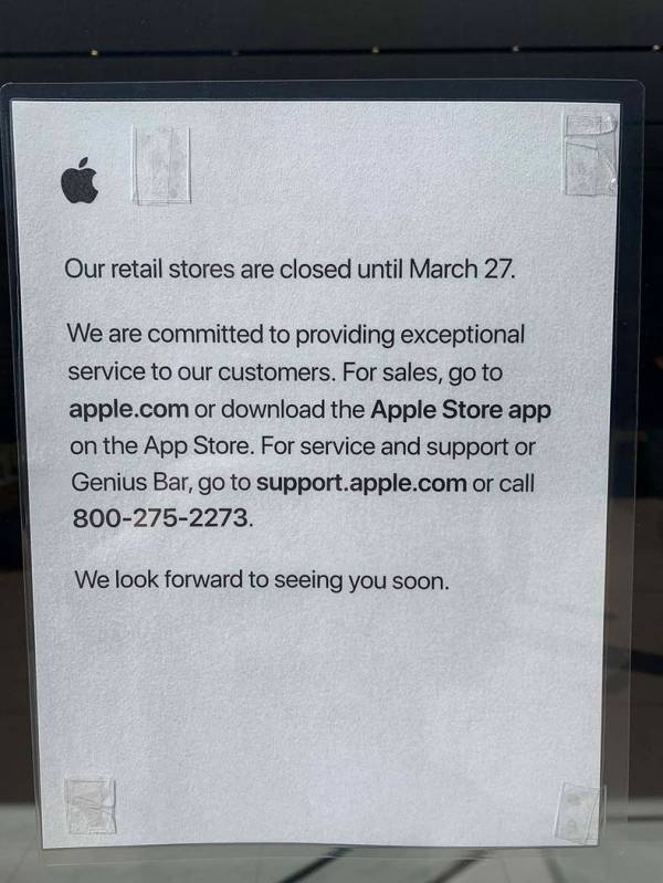 A sign on the door at the Apple Store in downtown Summerlin alerts customers that the store is ...