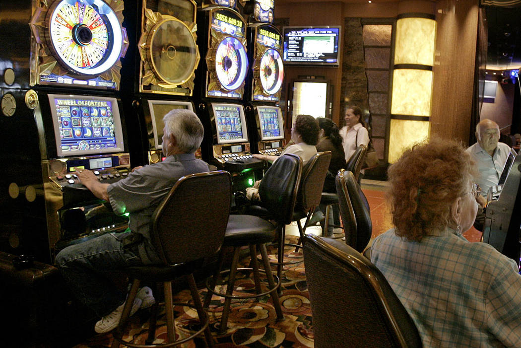 In this June 8, 2006, file photo, Patrons at the San Manuel Indian Bingo & Casino play slot mac ...