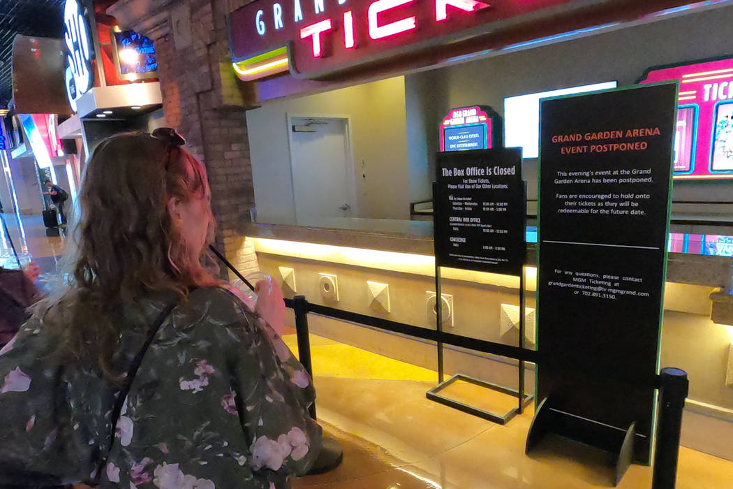 A closed ticket box shows a sign advicing visitors of a postponed event at the MGM Grand Garden ...