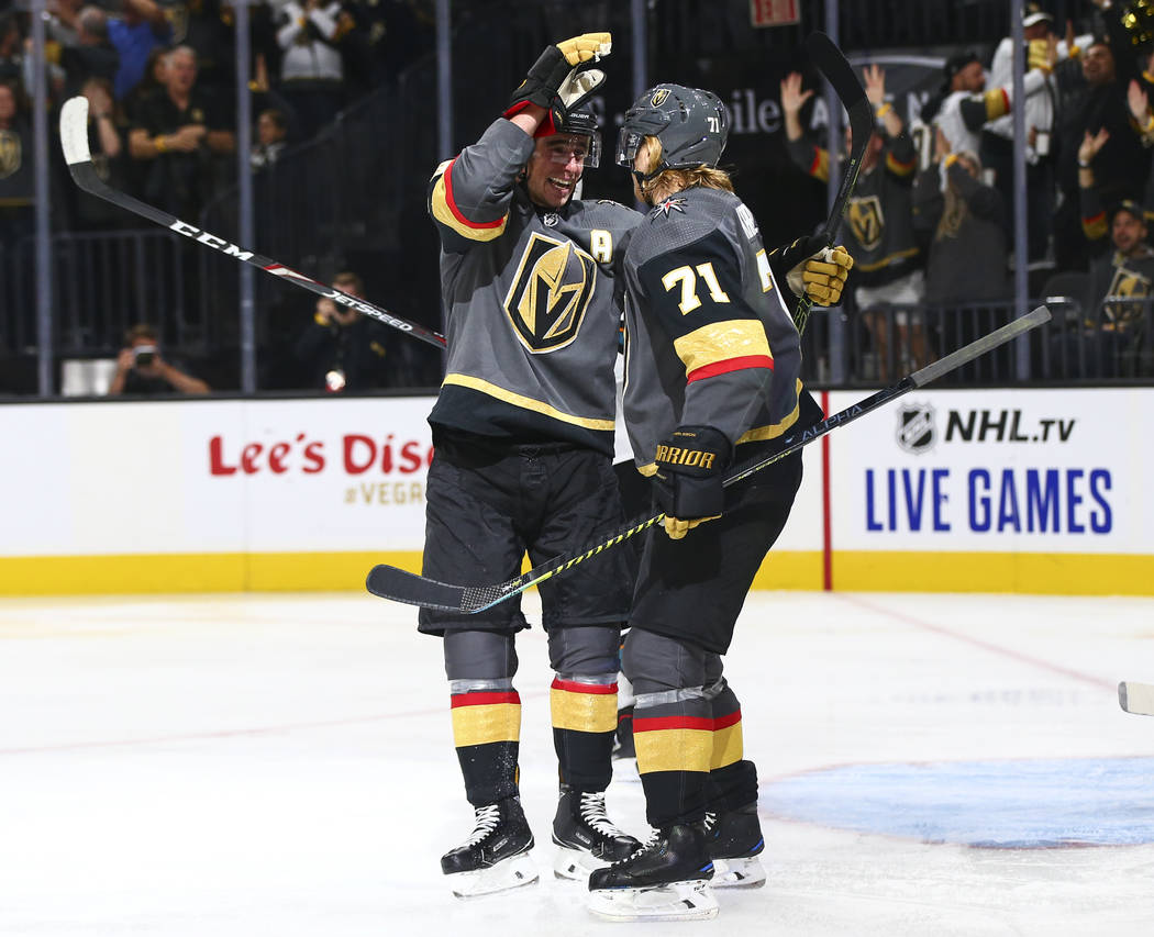 Golden Knights' Reilly Smith, left, and William Karlsson (71) celebrate a shorthanded goal agai ...