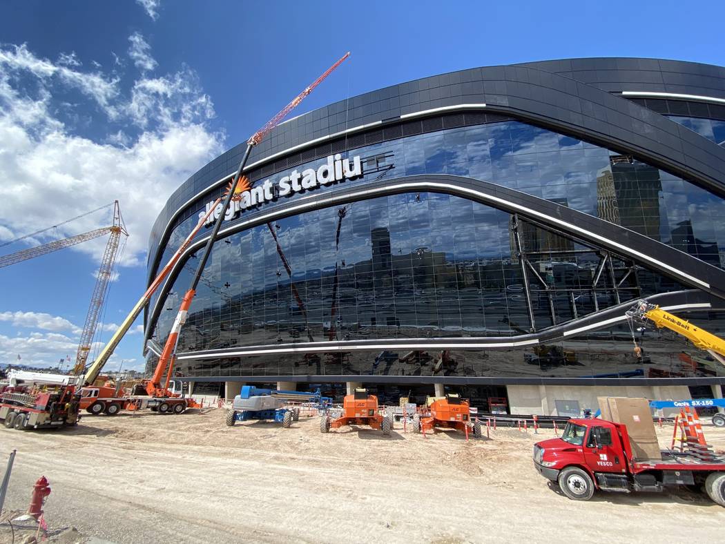 Yesco crews removed the "m" on the Allegiant Stadium sign Sunday, March 15, 2020, to readjust i ...