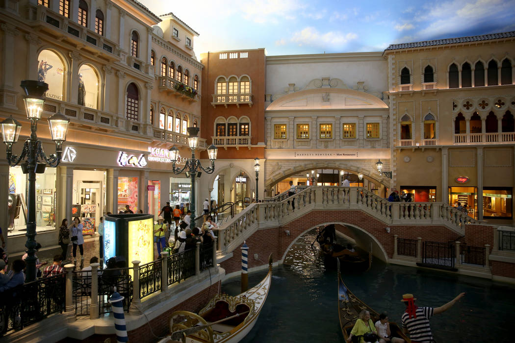 Gondolas float past St. Mark's Square at The Venetian on the Strip in Las Vegas Thursday, April ...