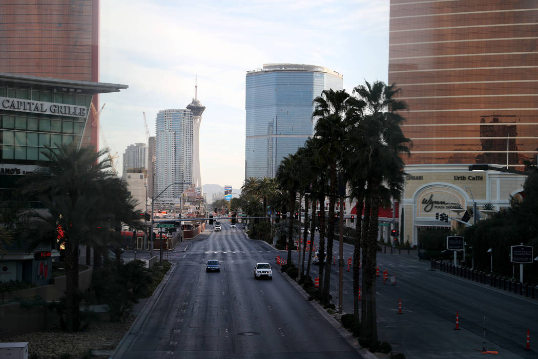 A few cars drive on Las Vegas Blvd., through the Las Vegas Strip on Monday morning, March 16, 2 ...