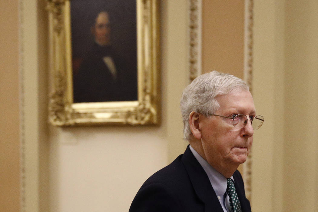 Senate Majority Leader Mitch McConnell of Ky. departs the Senate Chamber on Capitol Hill in Was ...