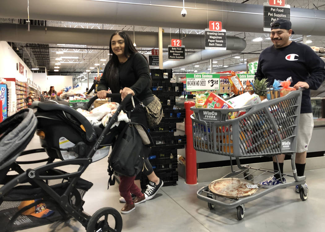 Virginia Rodriguez and her husband Jesse De La Torre shop at WinCo Foods on Monday, March 16, 2 ...