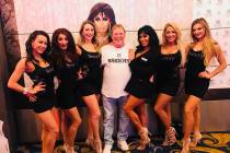 Raiders owner Mark Davis is shown with Jennifer Romas, at his left, and the cast of "Sexxy" at ...
